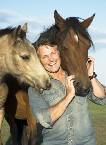 Happy man with horses